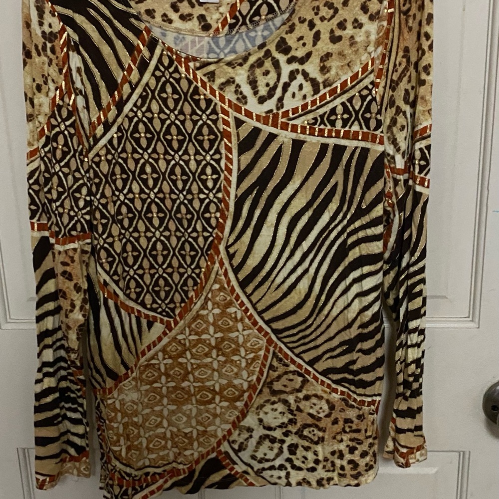 Long sleeve blouse made in South Africa. Made by Chicos size 1.